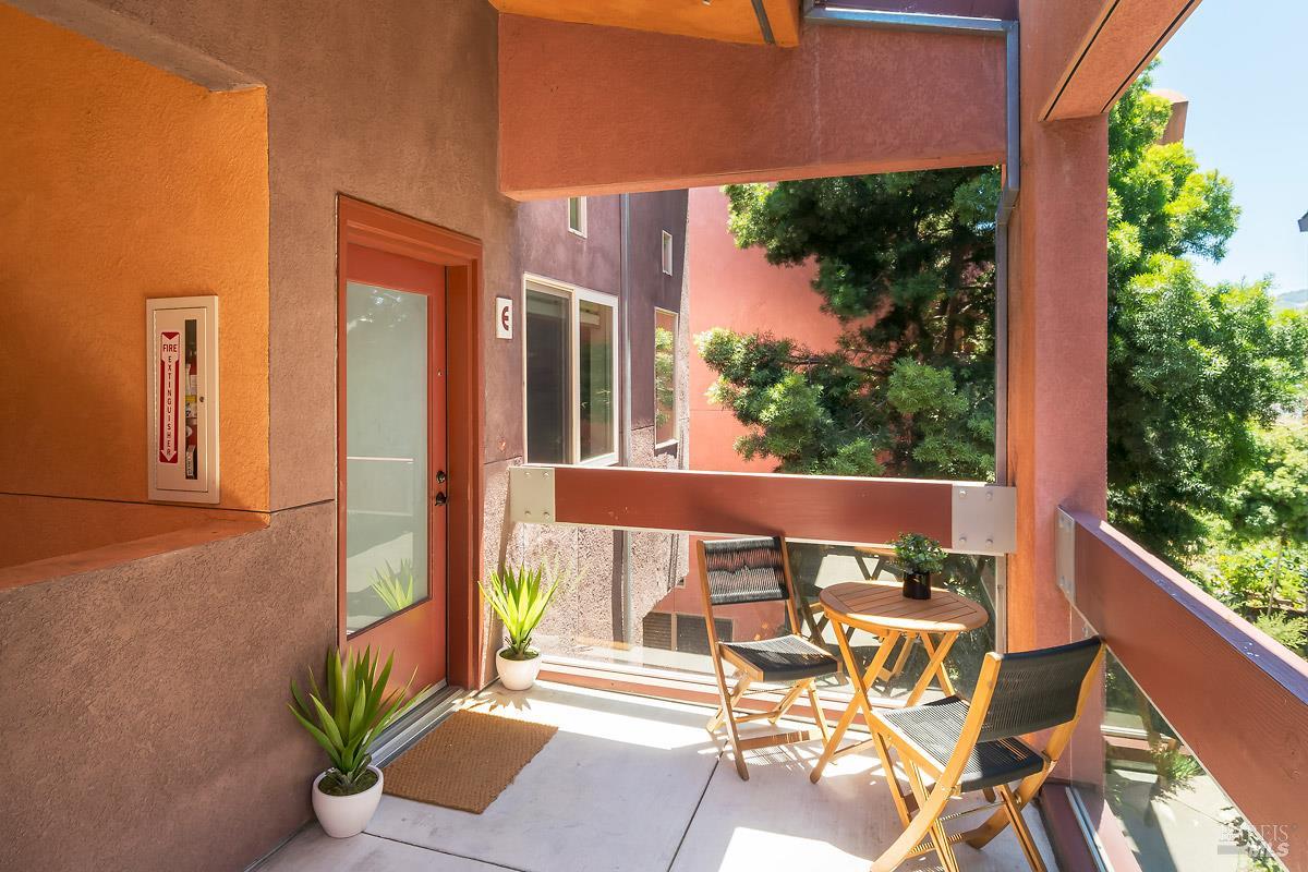 1354 Yulupa Avenue, Unit E Santa Rosa, CA 95405 - Photo 2 of 24 a view of a chairs and table in patio