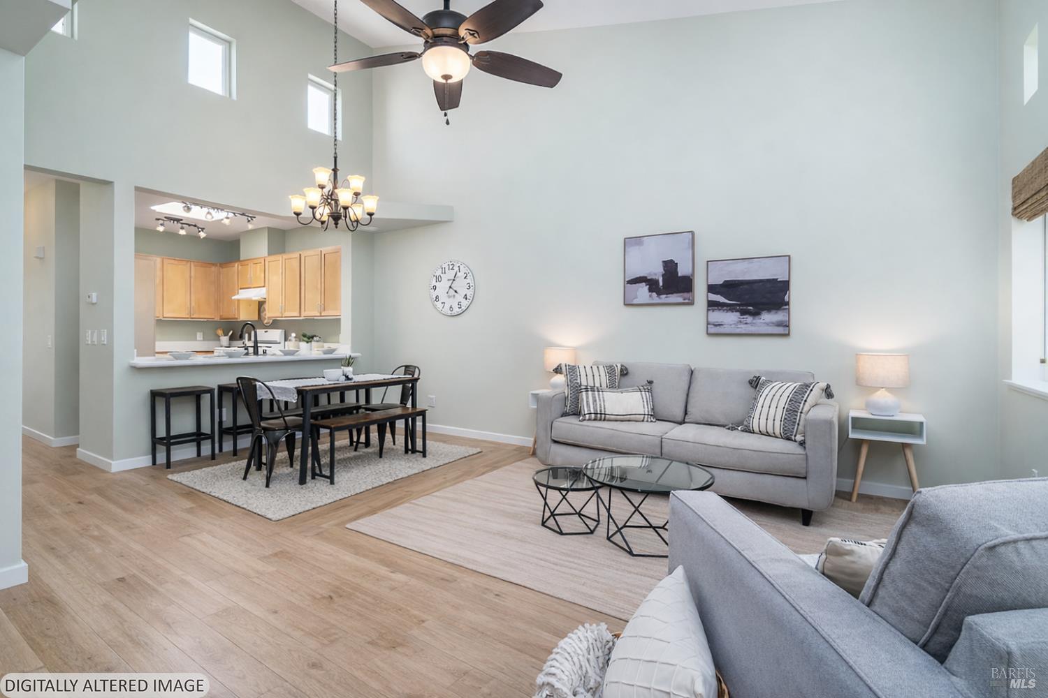 1354 Yulupa Avenue, Unit E Santa Rosa, CA 95405 - Photo 4 of 24 a living room with furniture and a chandelier