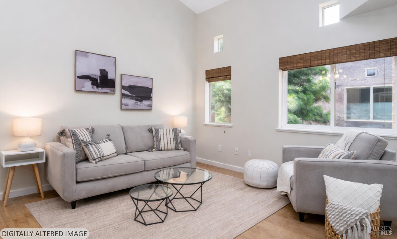 1354 Yulupa Avenue, Unit E Santa Rosa, CA 95405 - Photo 5 of 24 a living room with furniture and a large window