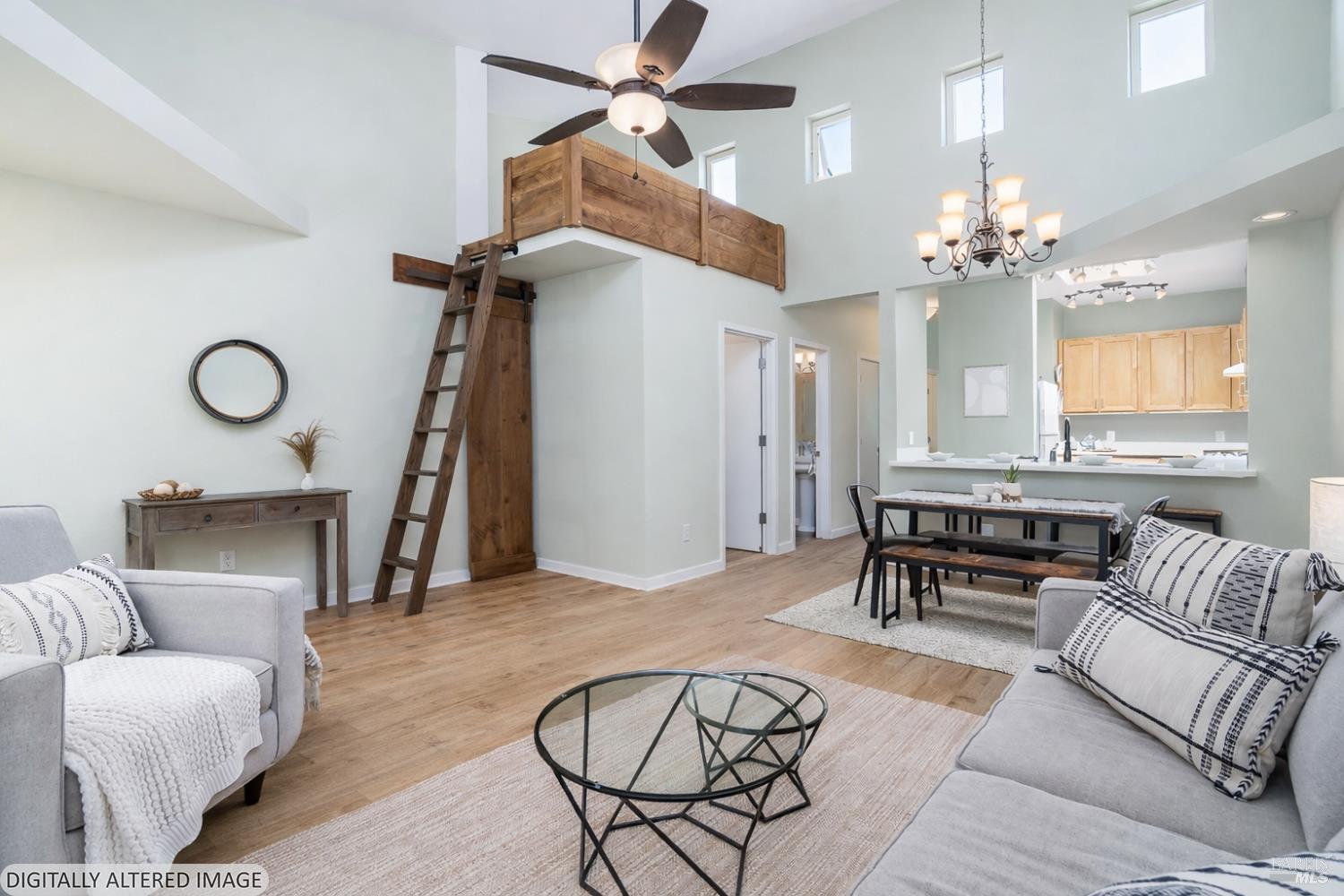 1354 Yulupa Avenue, Unit E Santa Rosa, CA 95405 - Photo 6 of 24 a living room with furniture a chandelier and a window