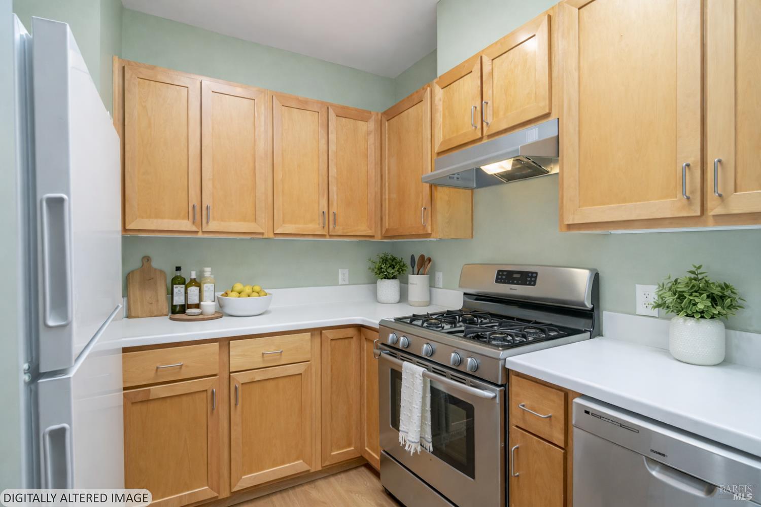 1354 Yulupa Avenue, Unit E Santa Rosa, CA 95405 - Photo 8 of 24 a kitchen with stainless steel appliances granite countertop a stove a sink and cabinets