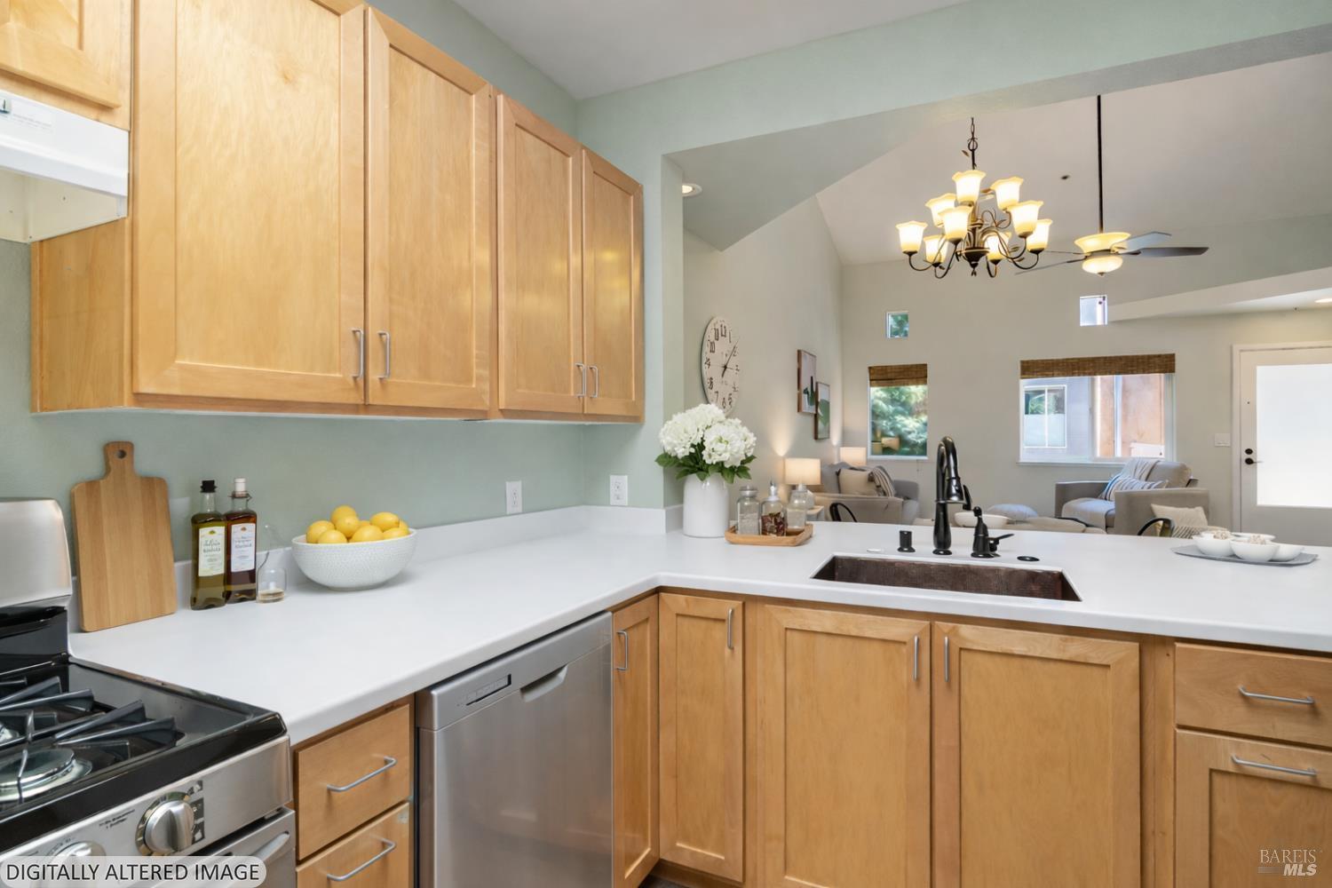 1354 Yulupa Avenue, Unit E Santa Rosa, CA 95405 - Photo 9 of 24 a kitchen with a sink dishwasher and white cabinets