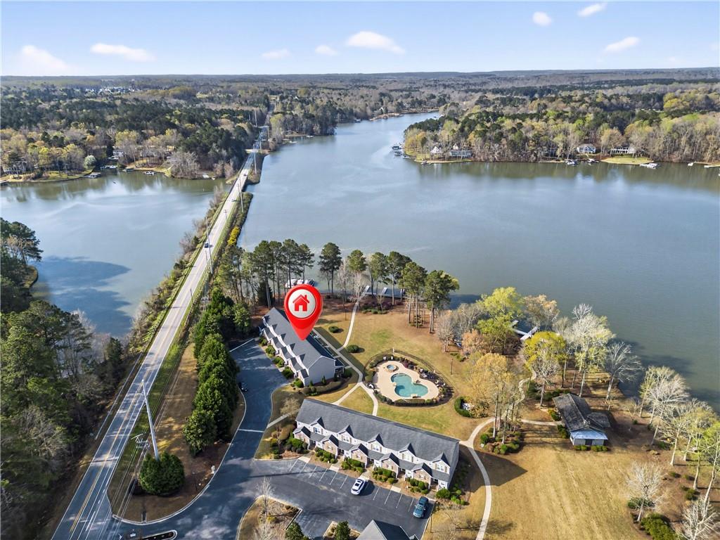 549 Old Phoenix Road Northeast, Unit 104 Eatonton, GA 31024 - Photo 40 of 48 an aerial view of a house with swimming pool and outdoor seating