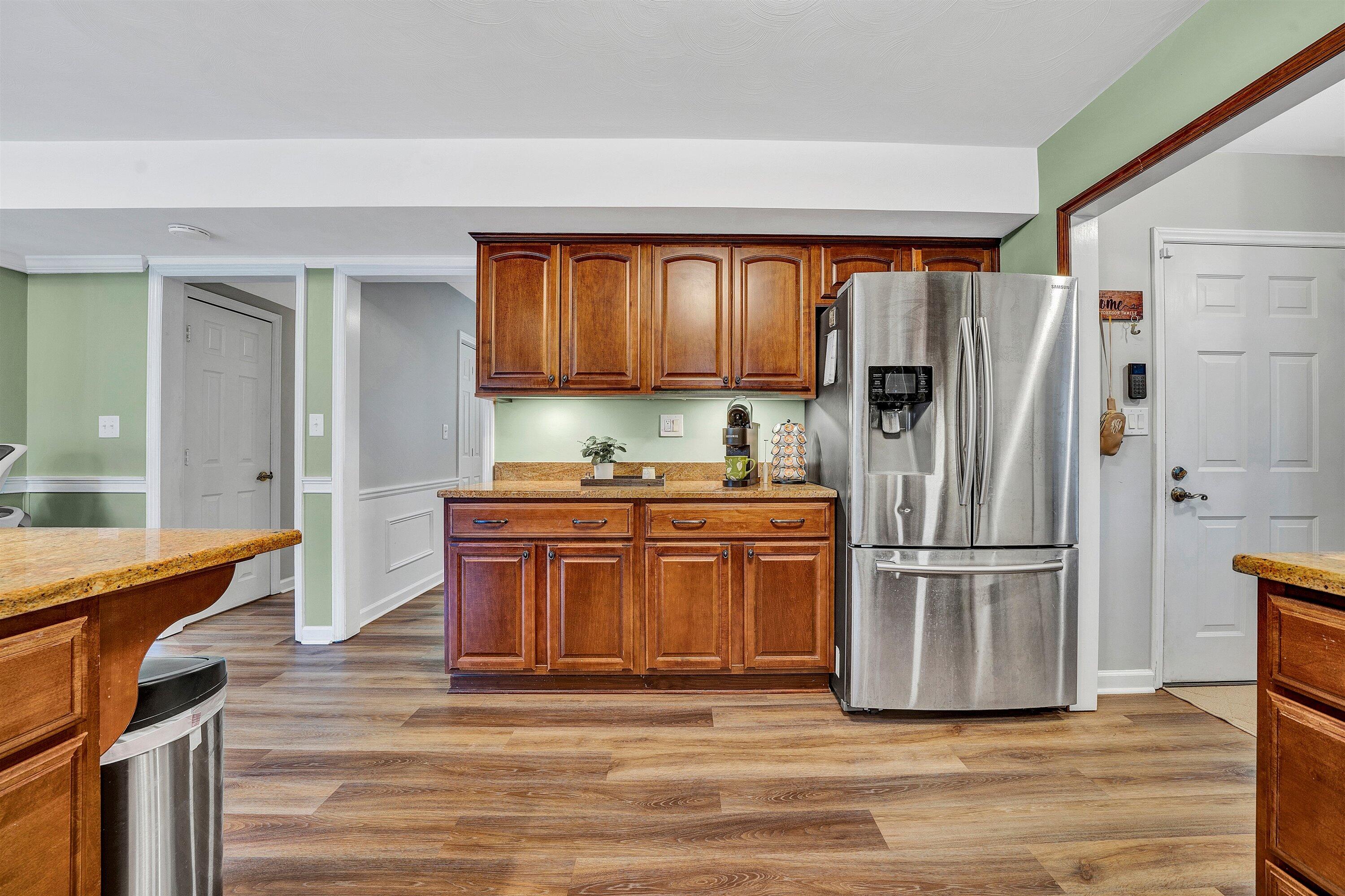 25 Charmwood Drive Blue Ridge, VA 24064 - Photo 12 of 35 a kitchen with stainless steel appliances granite countertop a refrigerator a stove and a wooden floors