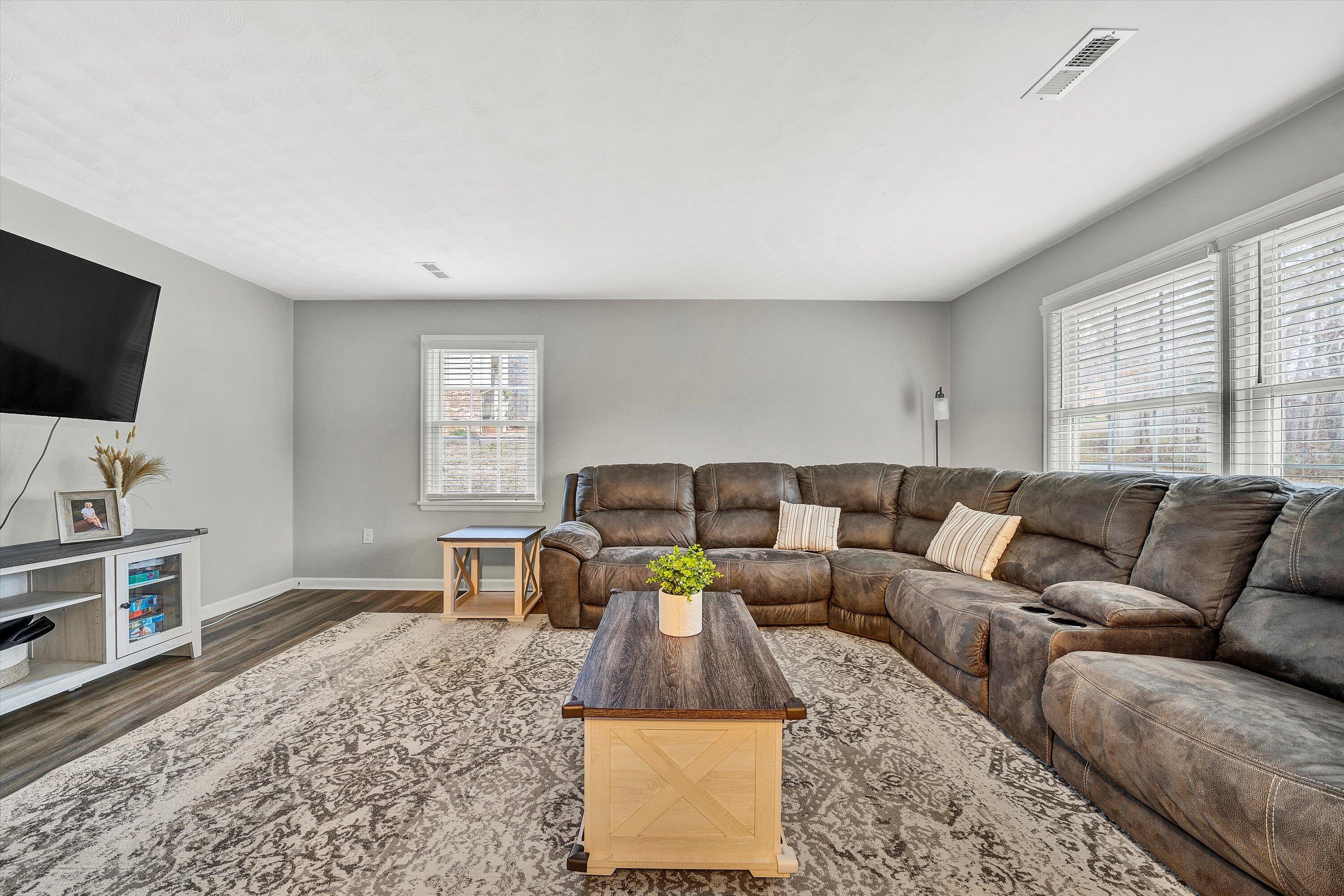 25 Charmwood Drive Blue Ridge, VA 24064 - Photo 6 of 35 a living room with furniture and a flat screen tv