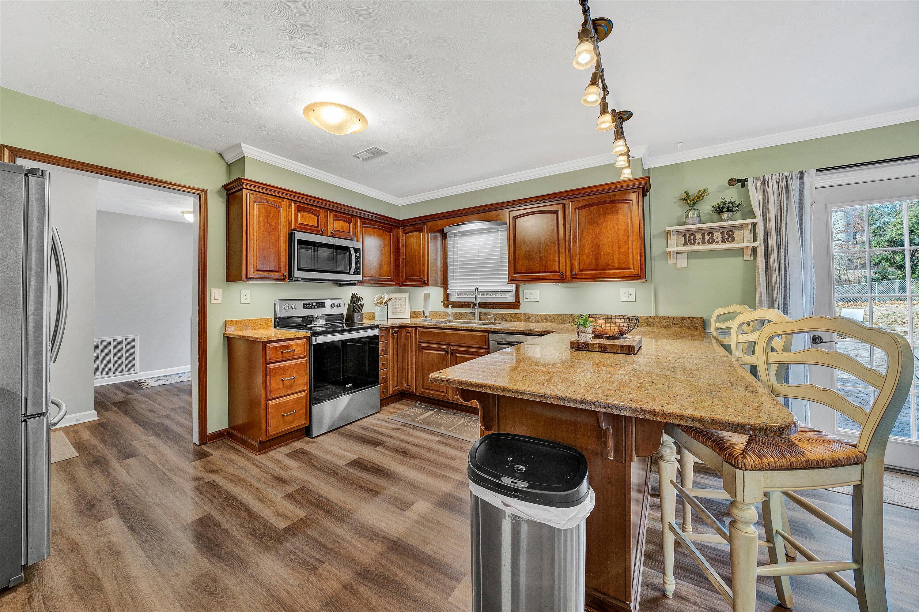 25 Charmwood Drive Blue Ridge, VA 24064 - Photo 8 of 35 a kitchen with stainless steel appliances granite countertop a sink stove and refrigerator