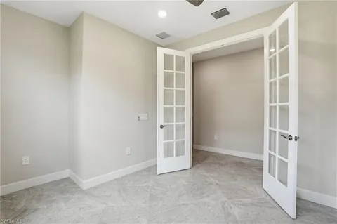 an empty room with windows