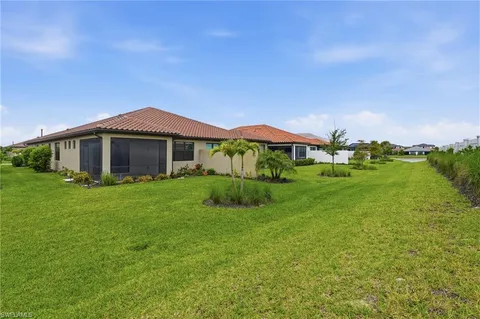 a view of a garden with an buildings in the background