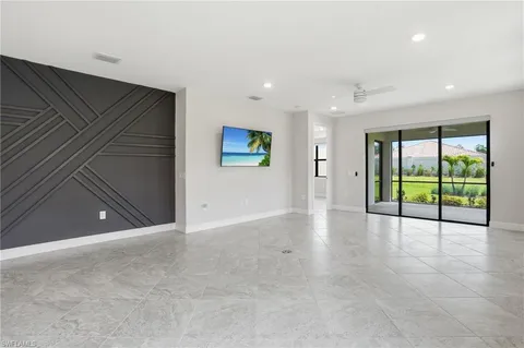a view of an empty room with glass door