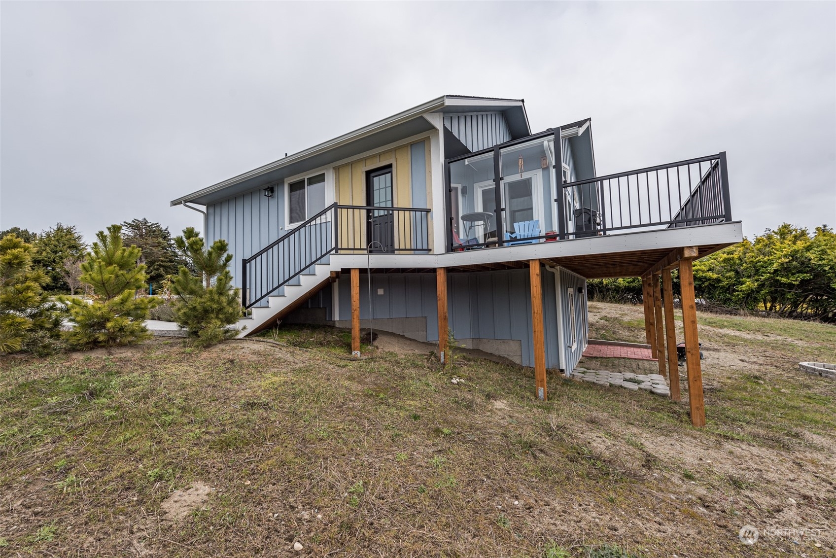 400 Ridge View Drive Sequim, WA 98382 - Photo 39 of 40 a house with wooden fence and bench
