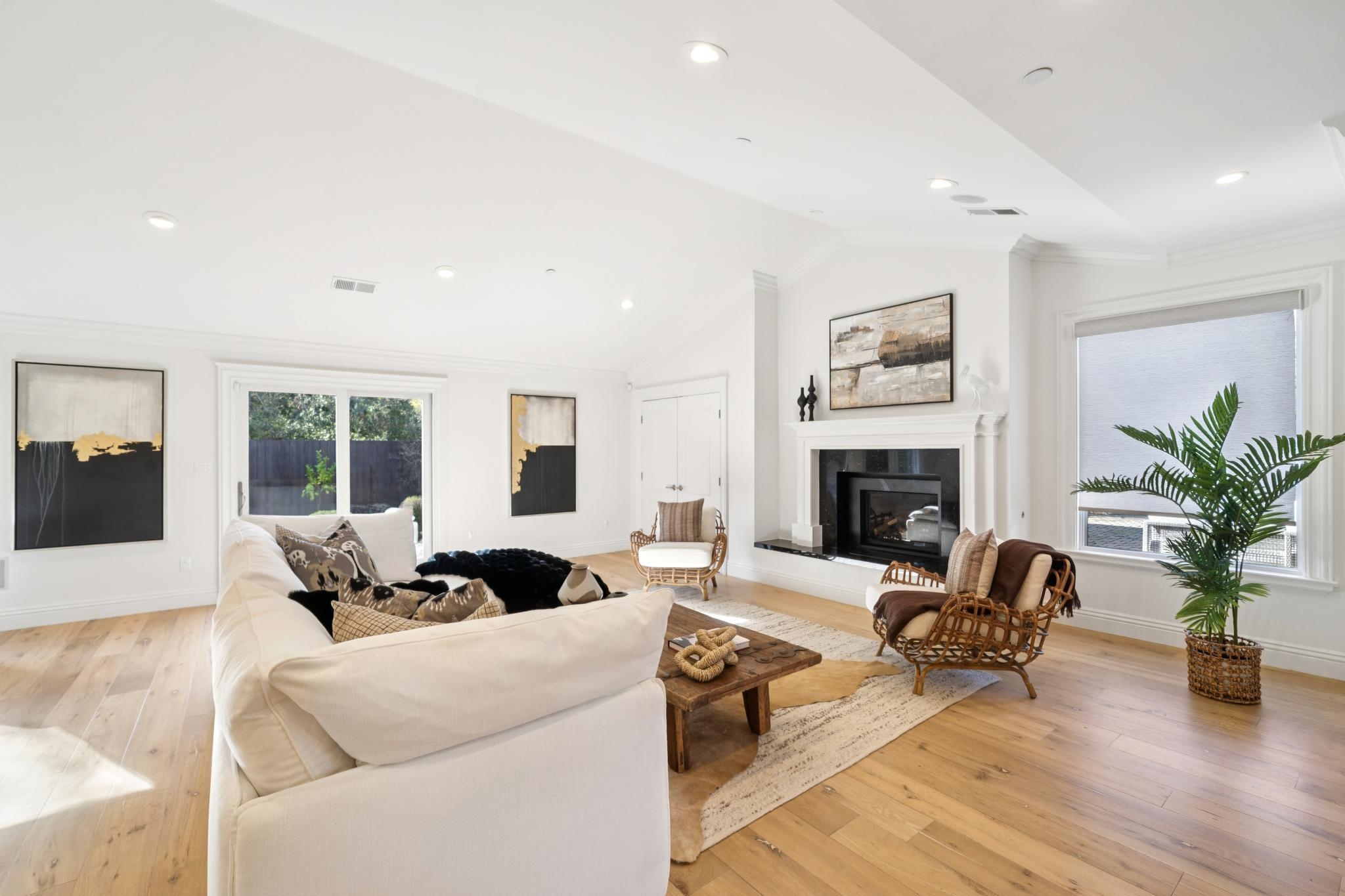 3957 Rancho Road Lafayette, CA 94549 - Photo 12 of 60 Living area featuring lofted ceiling, a glass covered fireplace, light wood-style flooring, crown molding, and recessed lighting
