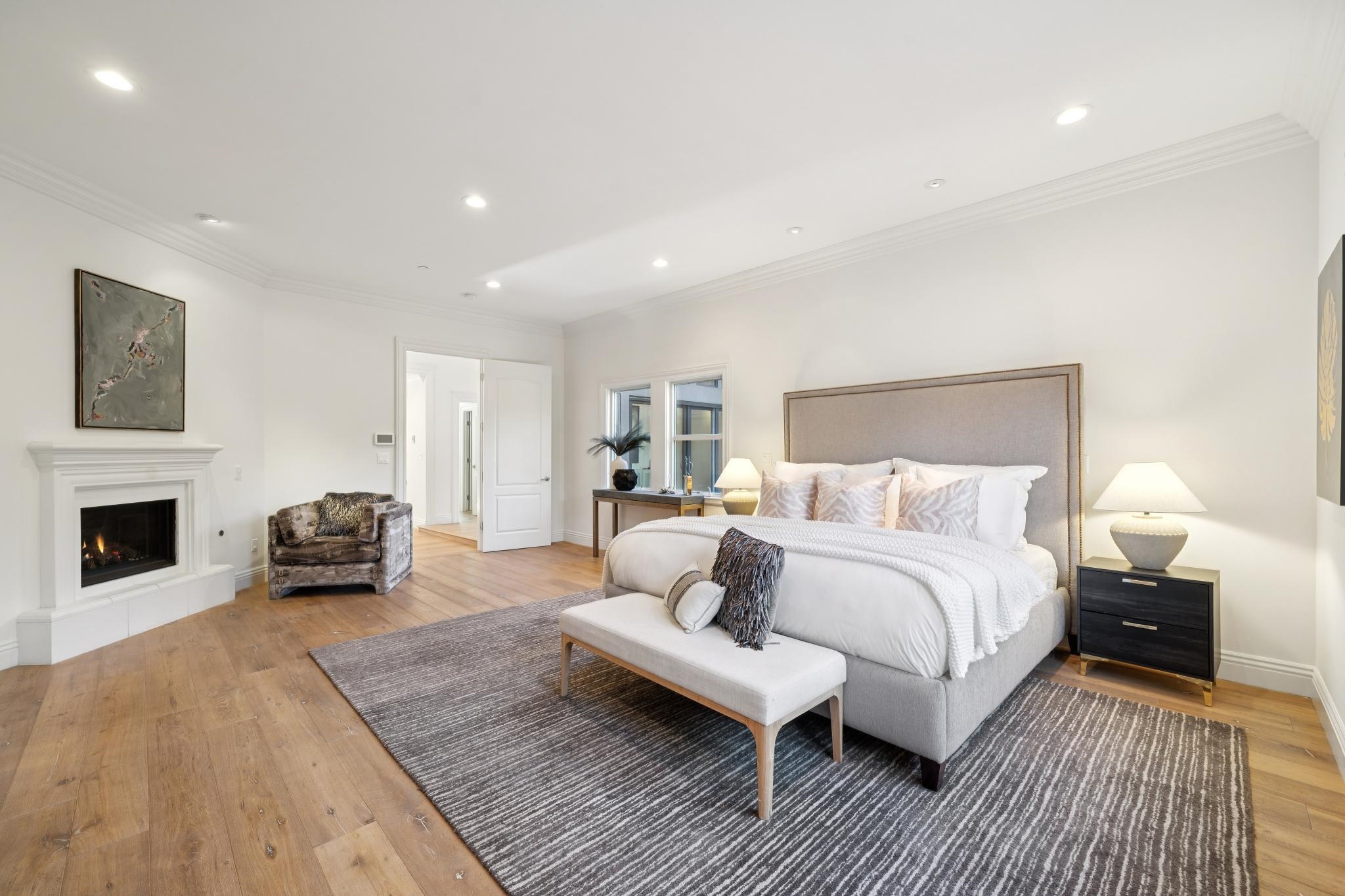 3957 Rancho Road Lafayette, CA 94549 - Photo 22 of 60 Bedroom featuring a warm lit fireplace, light wood-type flooring, recessed lighting, and crown molding
