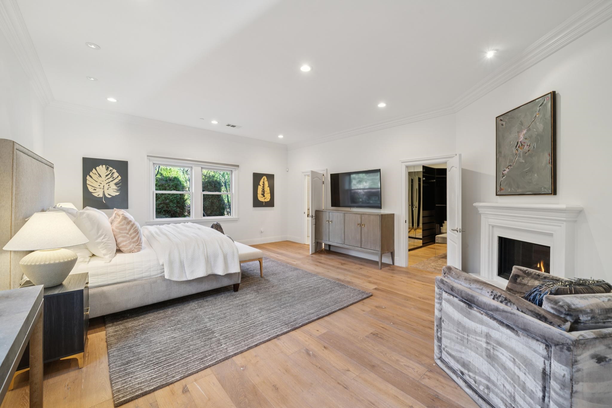 3957 Rancho Road Lafayette, CA 94549 - Photo 23 of 60 Bedroom with ornamental molding, light wood-style floors, a warm lit fireplace, and recessed lighting