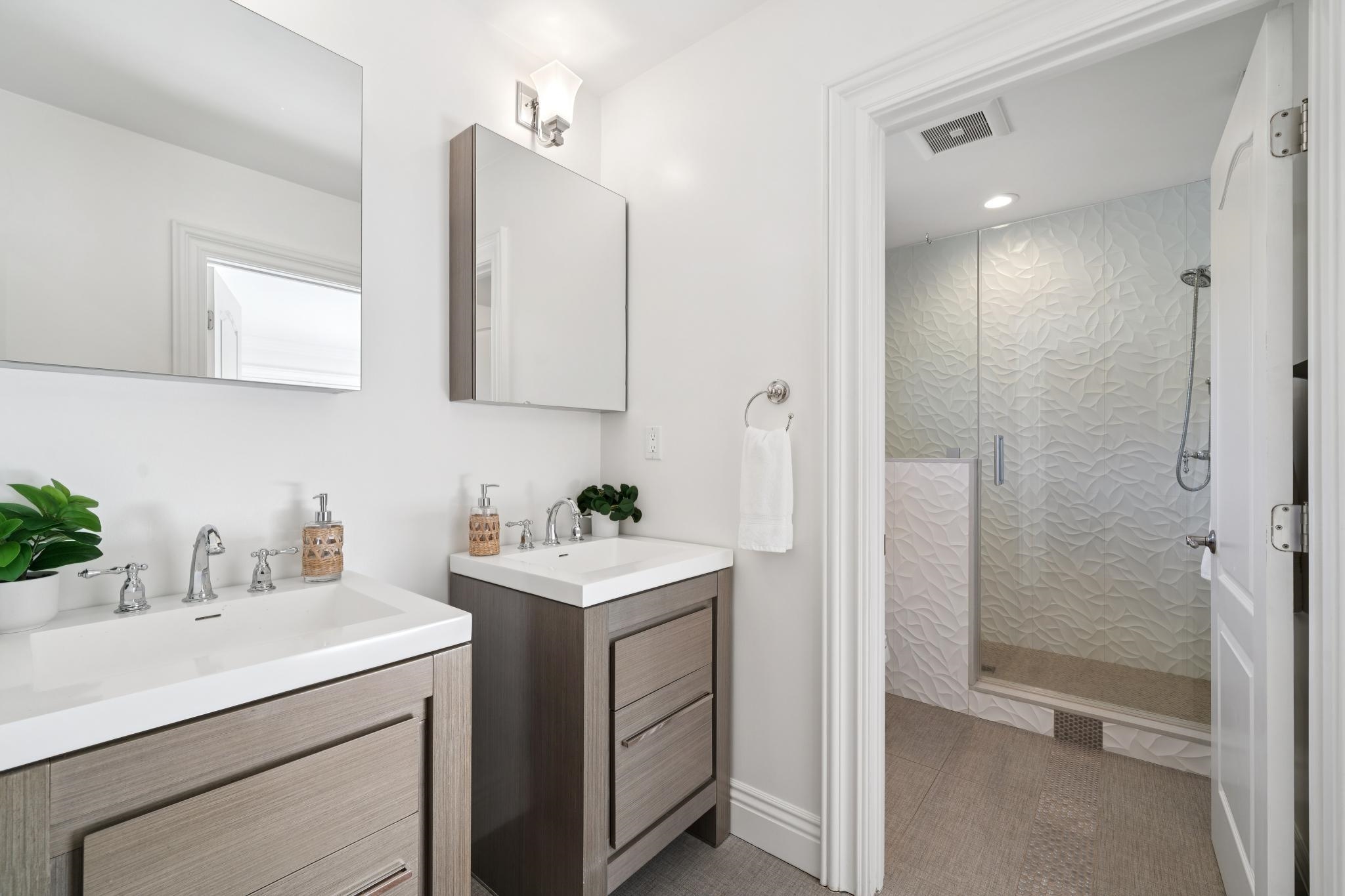 3957 Rancho Road Lafayette, CA 94549 - Photo 29 of 60 Full bath with two vanities, a shower stall, tile patterned flooring, and recessed lighting