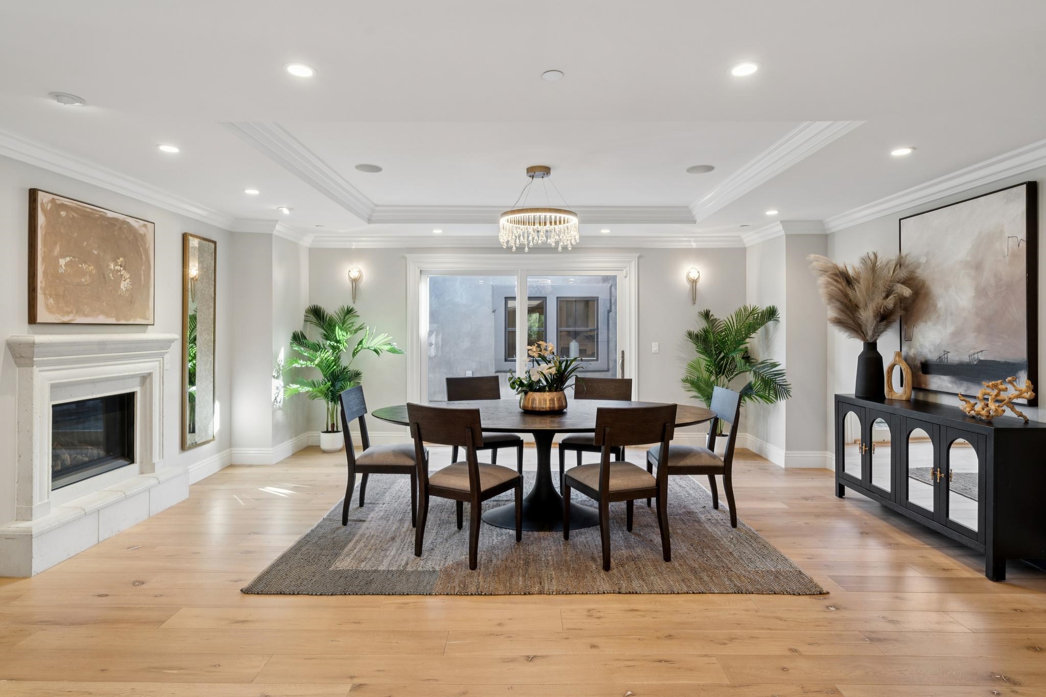 3957 Rancho Road Lafayette, CA 94549 - Photo 7 of 60 Dining room featuring a tray ceiling, light wood-type flooring, crown molding, a glass covered fireplace, and recessed lighting