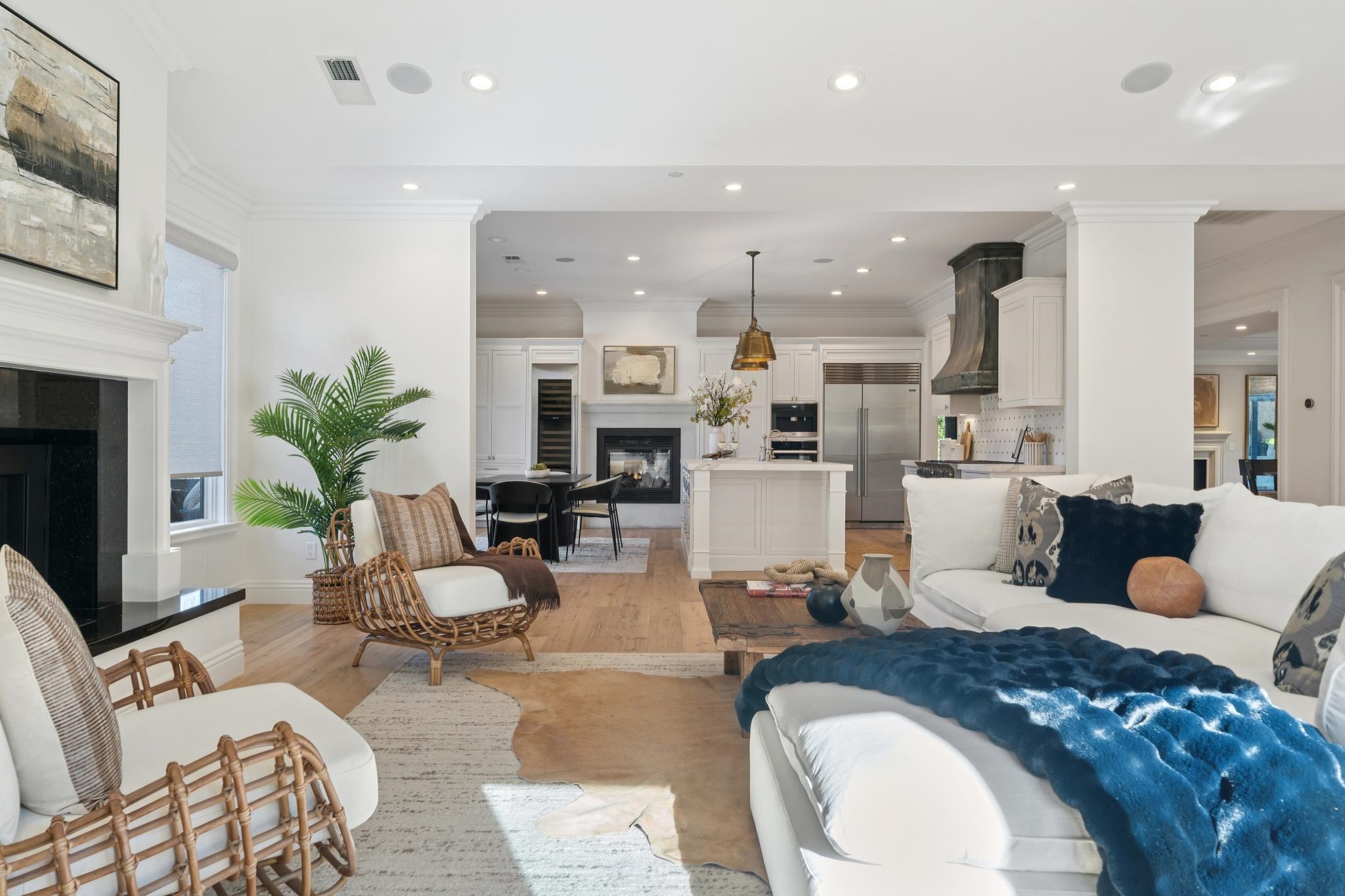 3957 Rancho Road Lafayette, CA 94549 - Photo 10 of 60 Living area featuring a glass covered fireplace, light wood-style floors, ornamental molding, recessed lighting, and wine cooler