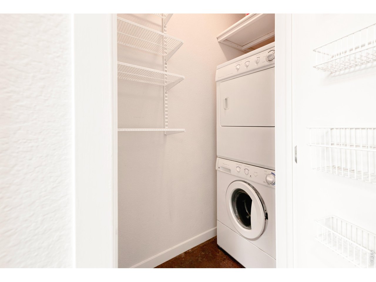 3033 Blake Street, Unit 112 Denver, CO 80205 - Photo 21 of 28 a close up view of a washer and dryer