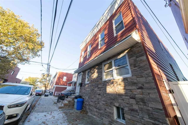 a backyard of a house with seating space