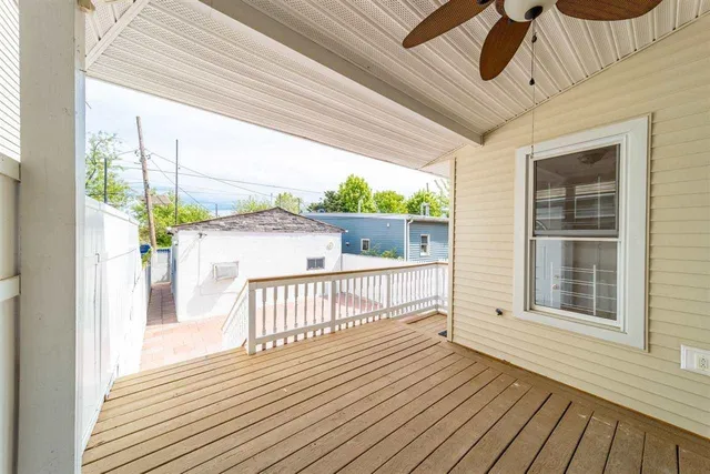 a view of a balcony with wooden floor