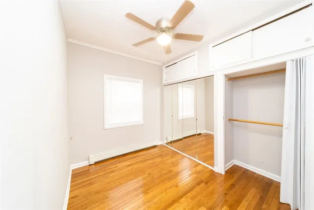 a view of a house with a wooden fence