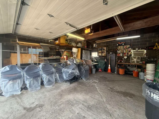 a view of a garage with parked cars