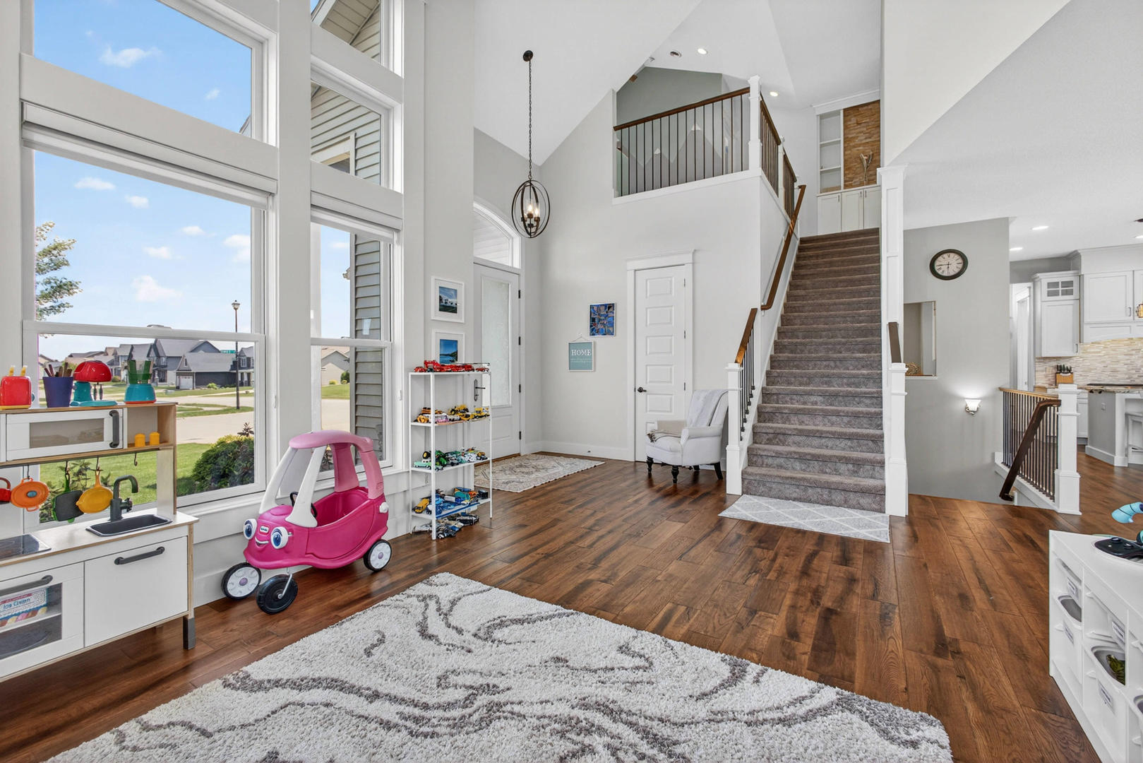5700 Emily Road Bettendorf, IA 52722 - Photo 4 of 58 a view of a livingroom with wooden floor and entryway