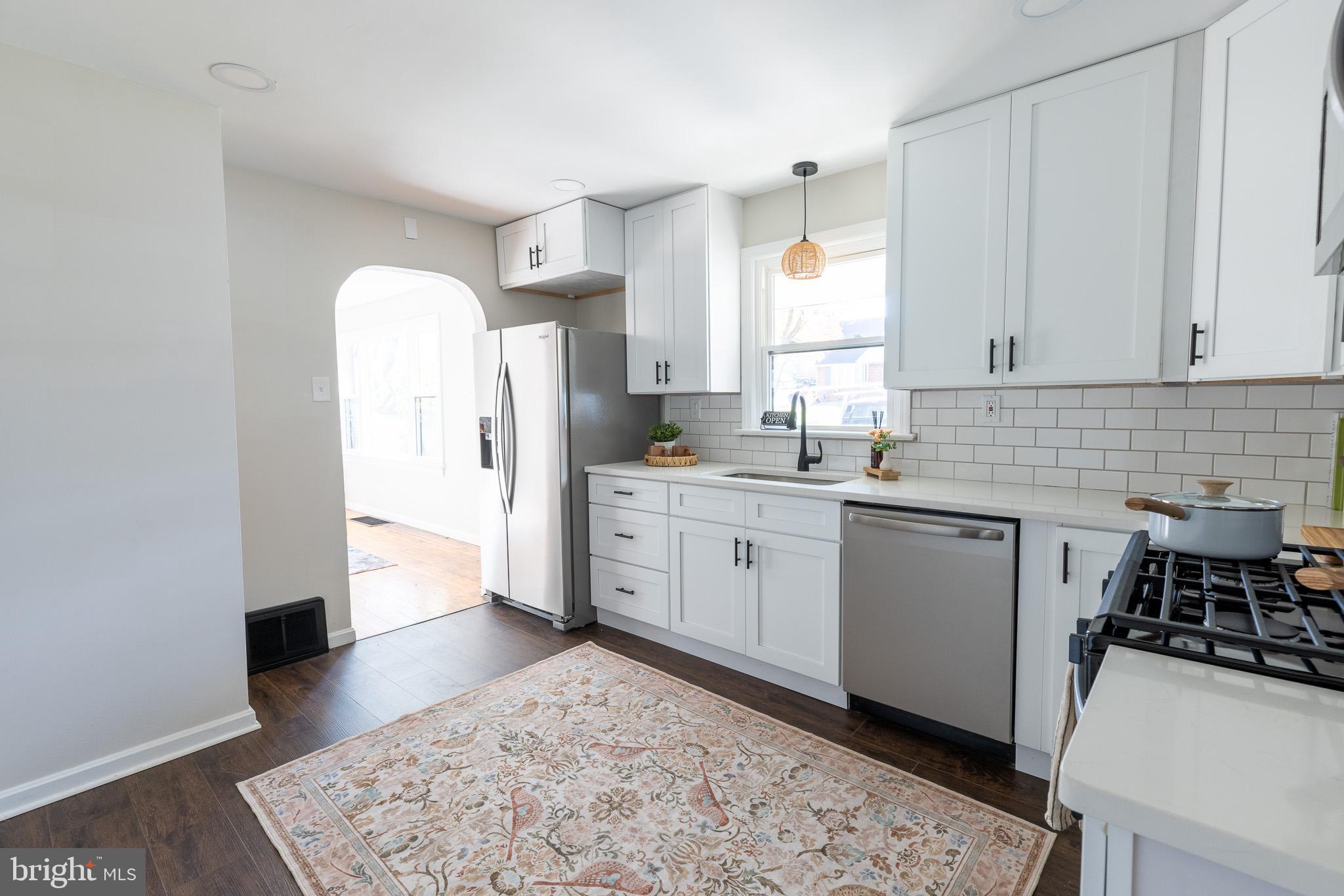 85 Homeland Road York, PA 17403 - Photo 7 of 26 a kitchen with a sink a refrigerator and cabinets