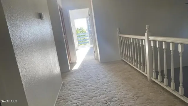 a bathroom with a sink vanity and mirror
