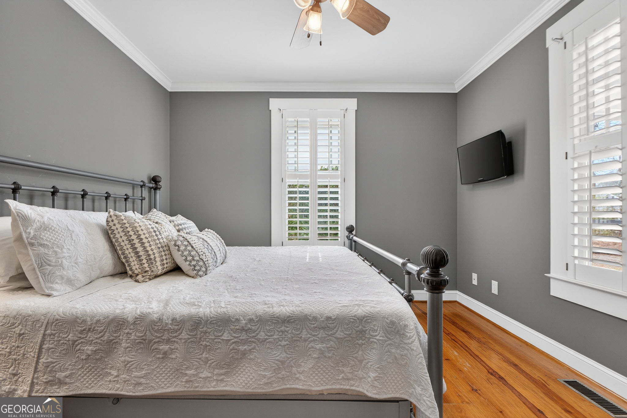 551 Carter Road Griffin, GA 30224 - Photo 37 of 86 a bedroom with a bed and a flat screen tv