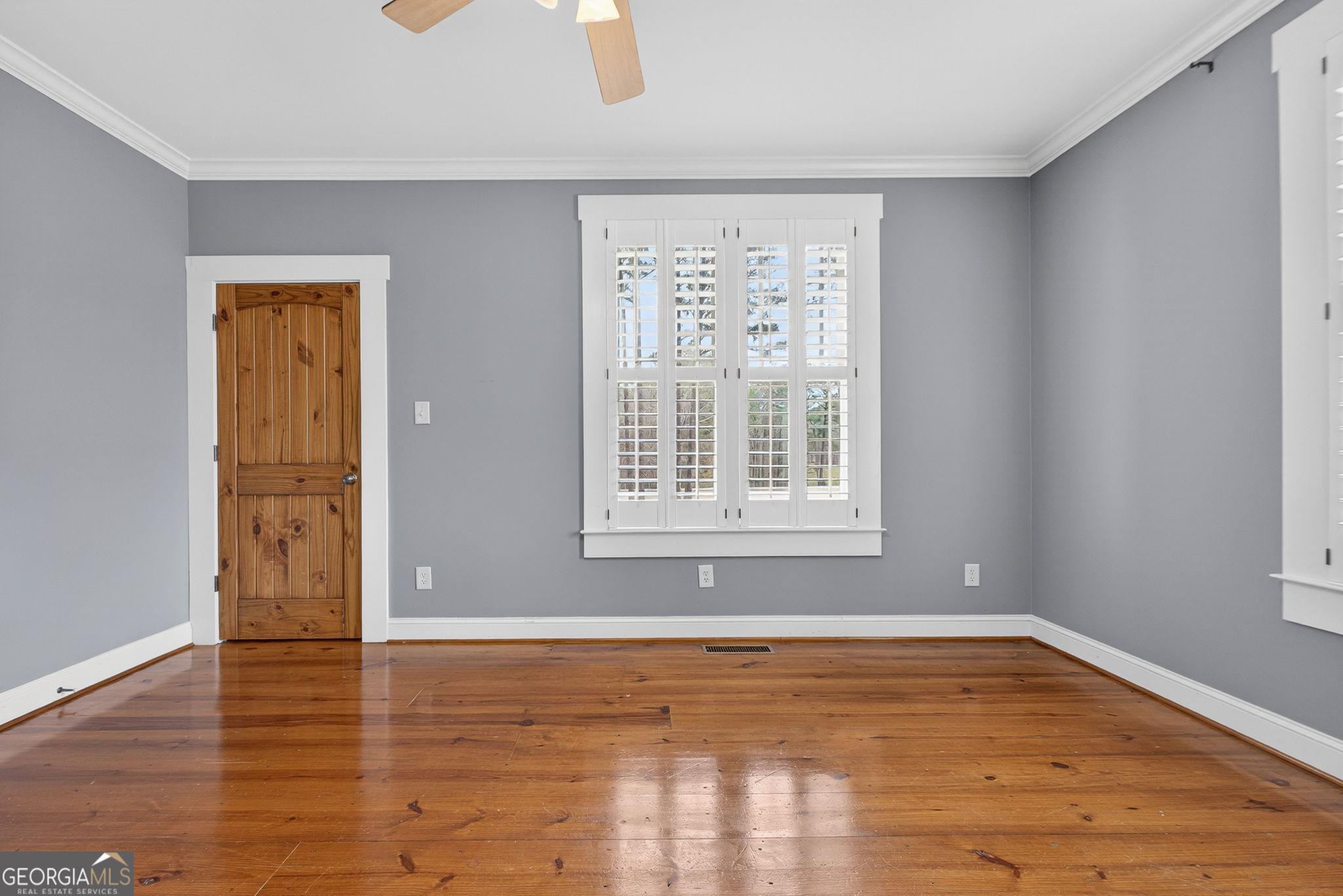 551 Carter Road Griffin, GA 30224 - Photo 38 of 86 a view of an empty room with wooden floor and a window