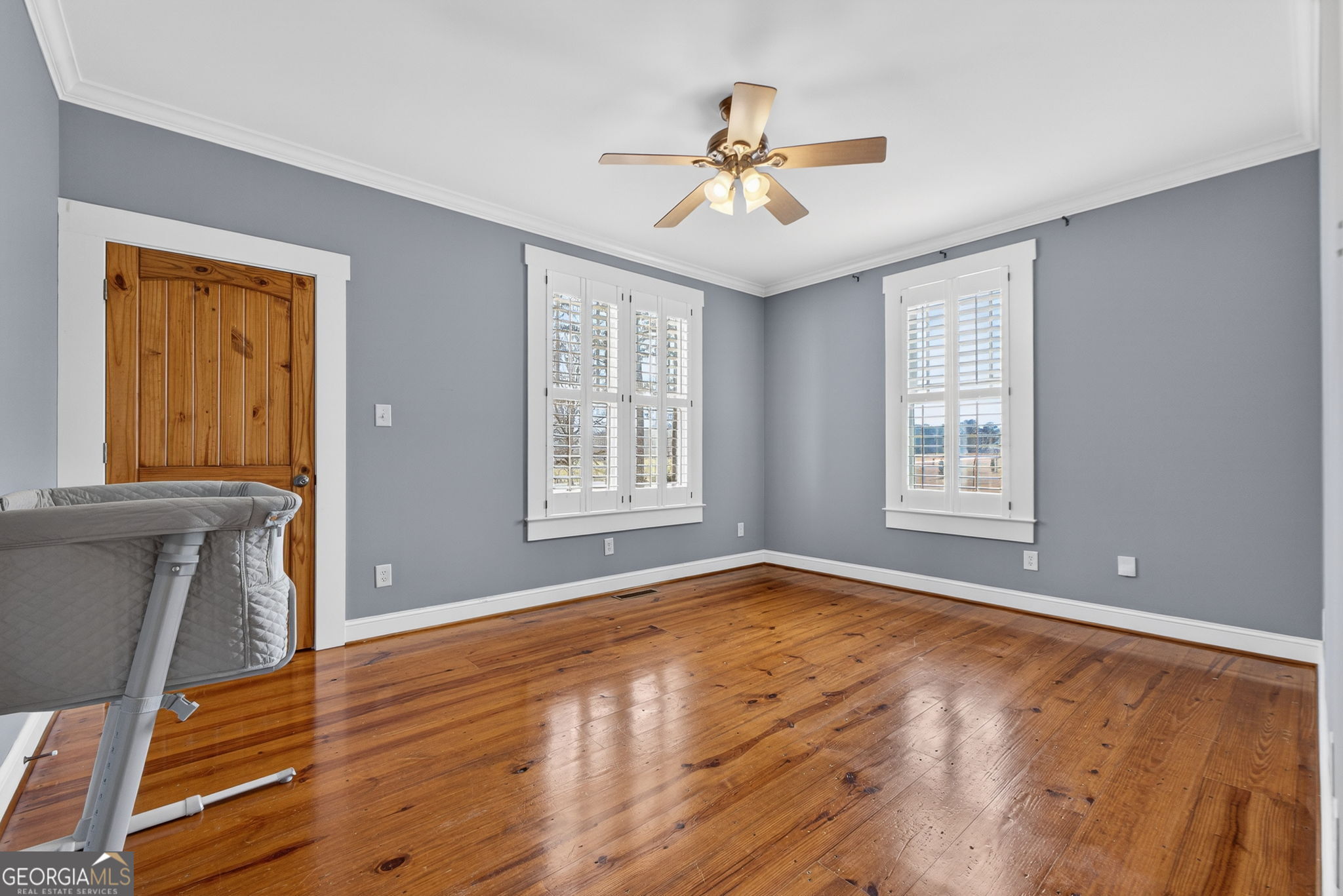 551 Carter Road Griffin, GA 30224 - Photo 39 of 86 a view of an empty room with window and wooden floor
