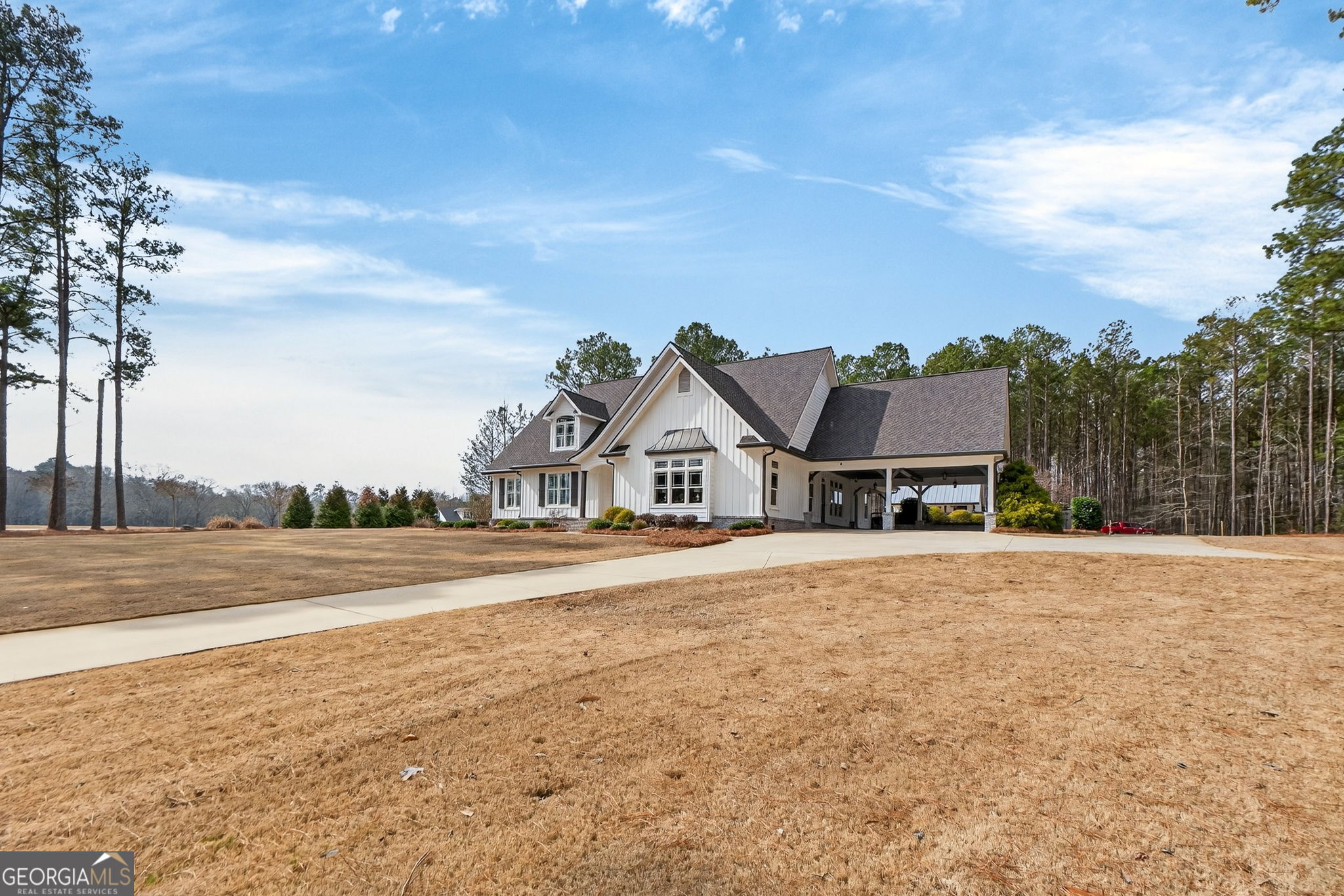 551 Carter Road Griffin, GA 30224 - Photo 5 of 86 an aerial view of a house with a big yard and large trees