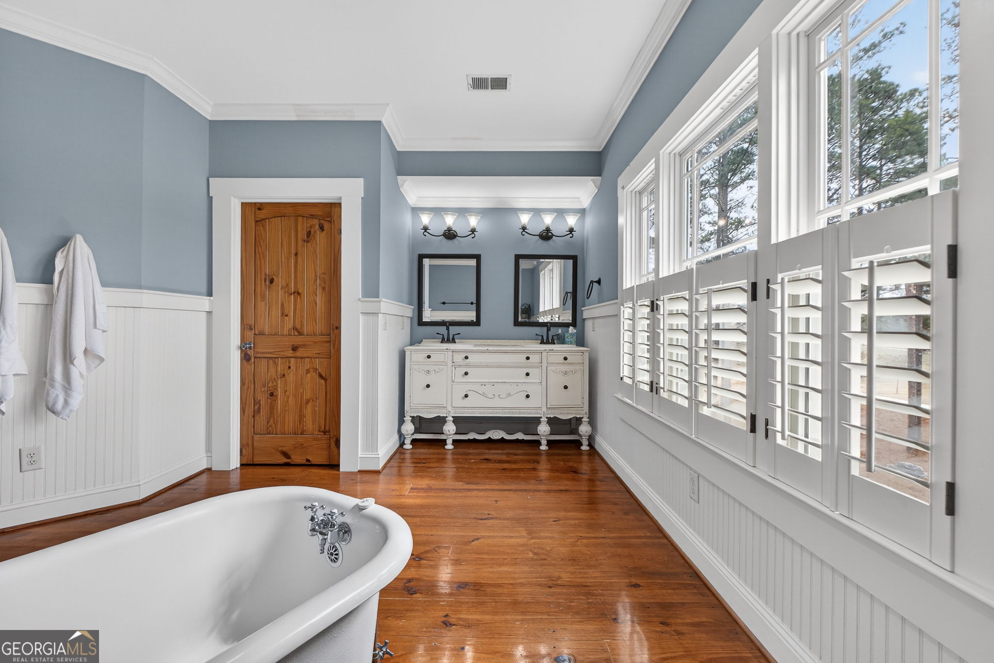 551 Carter Road Griffin, GA 30224 - Photo 54 of 86 a bathroom with a tub a sink and a large window