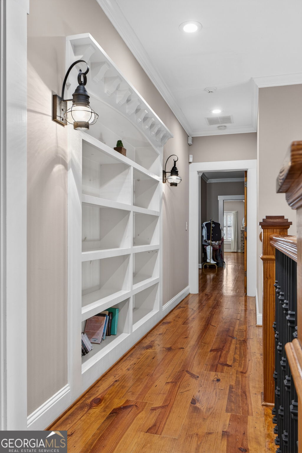 551 Carter Road Griffin, GA 30224 - Photo 58 of 86 a view of a hallway with wooden floor and cabinet