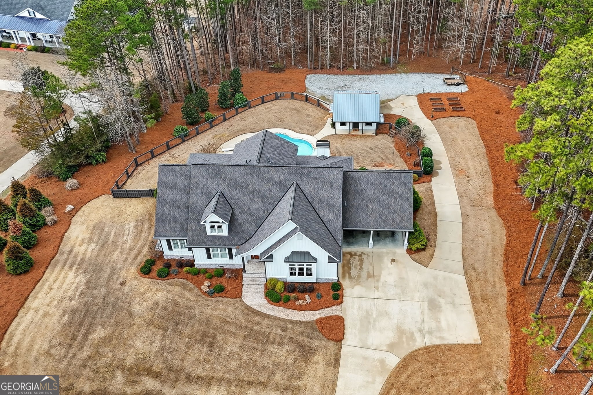 551 Carter Road Griffin, GA 30224 - Photo 80 of 86 an aerial view of a house with swimming pool and large trees