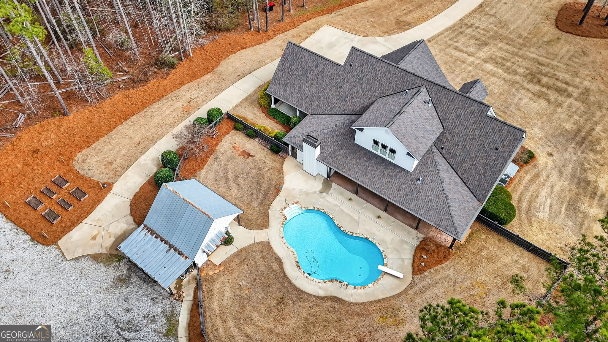 551 Carter Road Griffin, GA 30224 - Photo 83 of 86 an aerial view of a house with a swimming pool and outdoor space