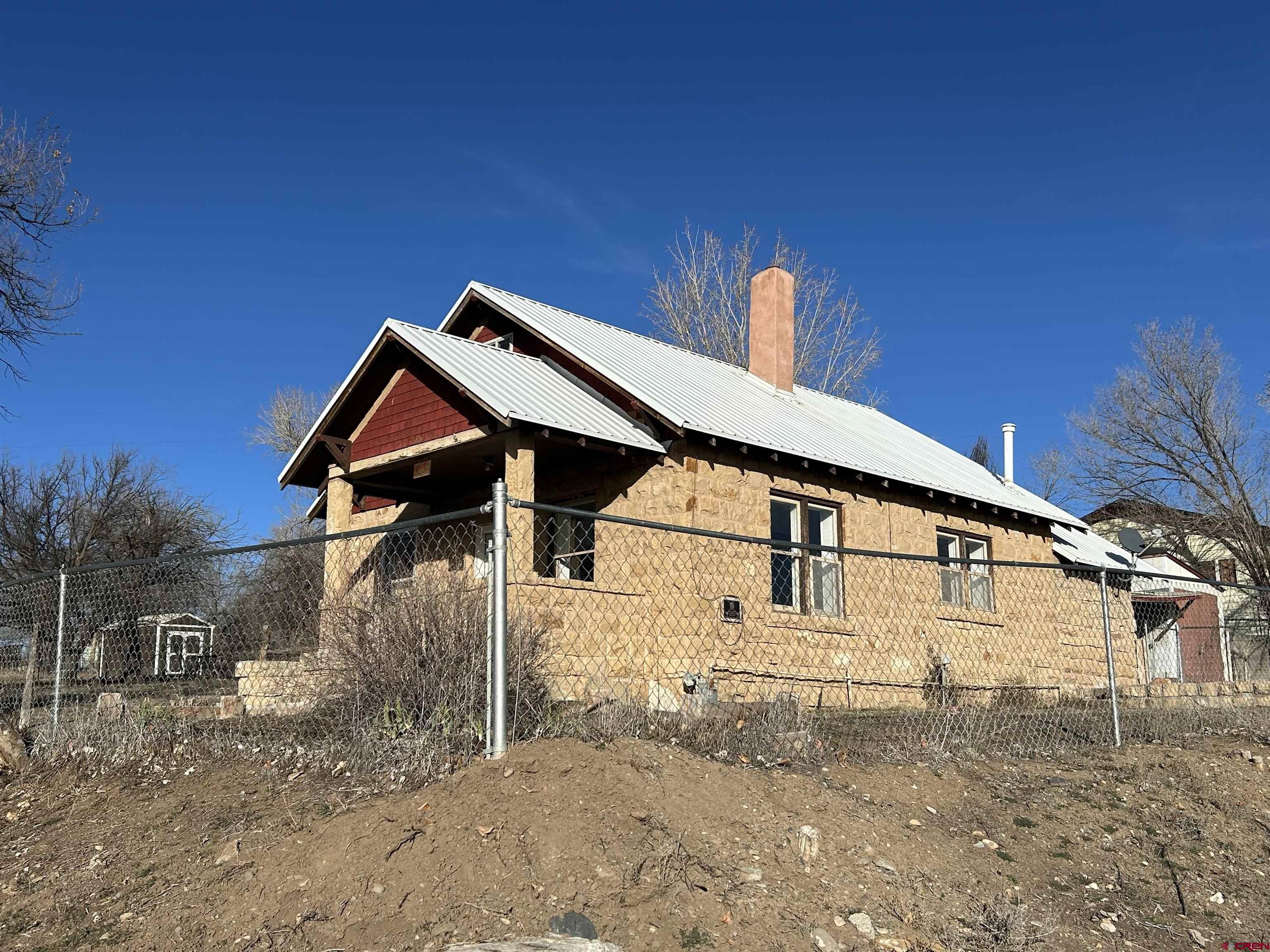 281 Fox Street Nucla, CO 81424 - Photo 2 of 21 a front view of a house with a yard