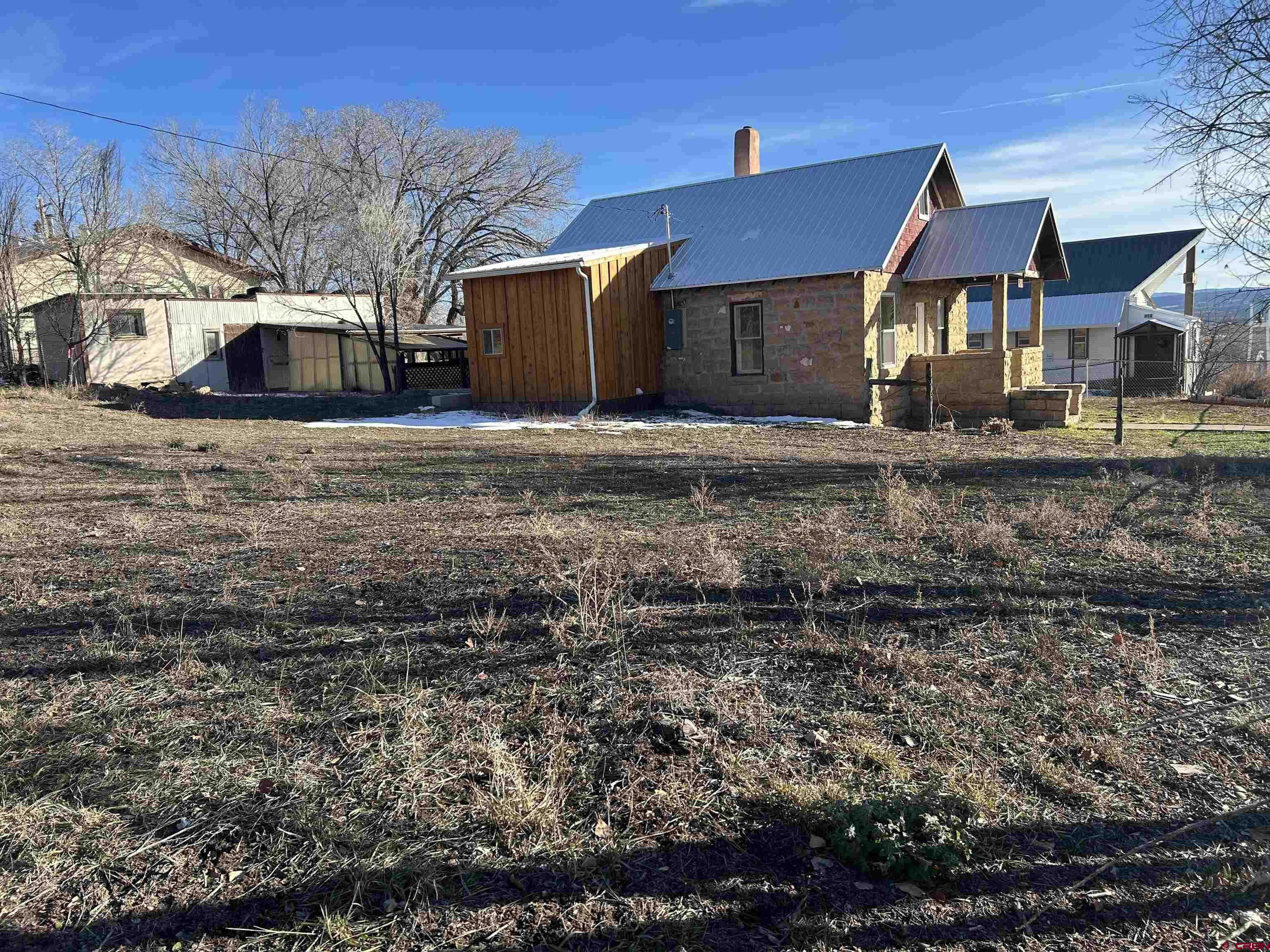 281 Fox Street Nucla, CO 81424 - Photo 3 of 21 a front view of a house with a yard