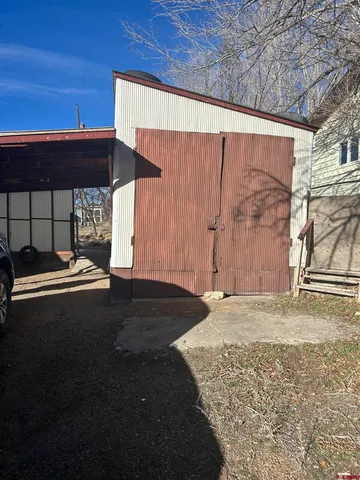 a view of an empty room and wooden floor