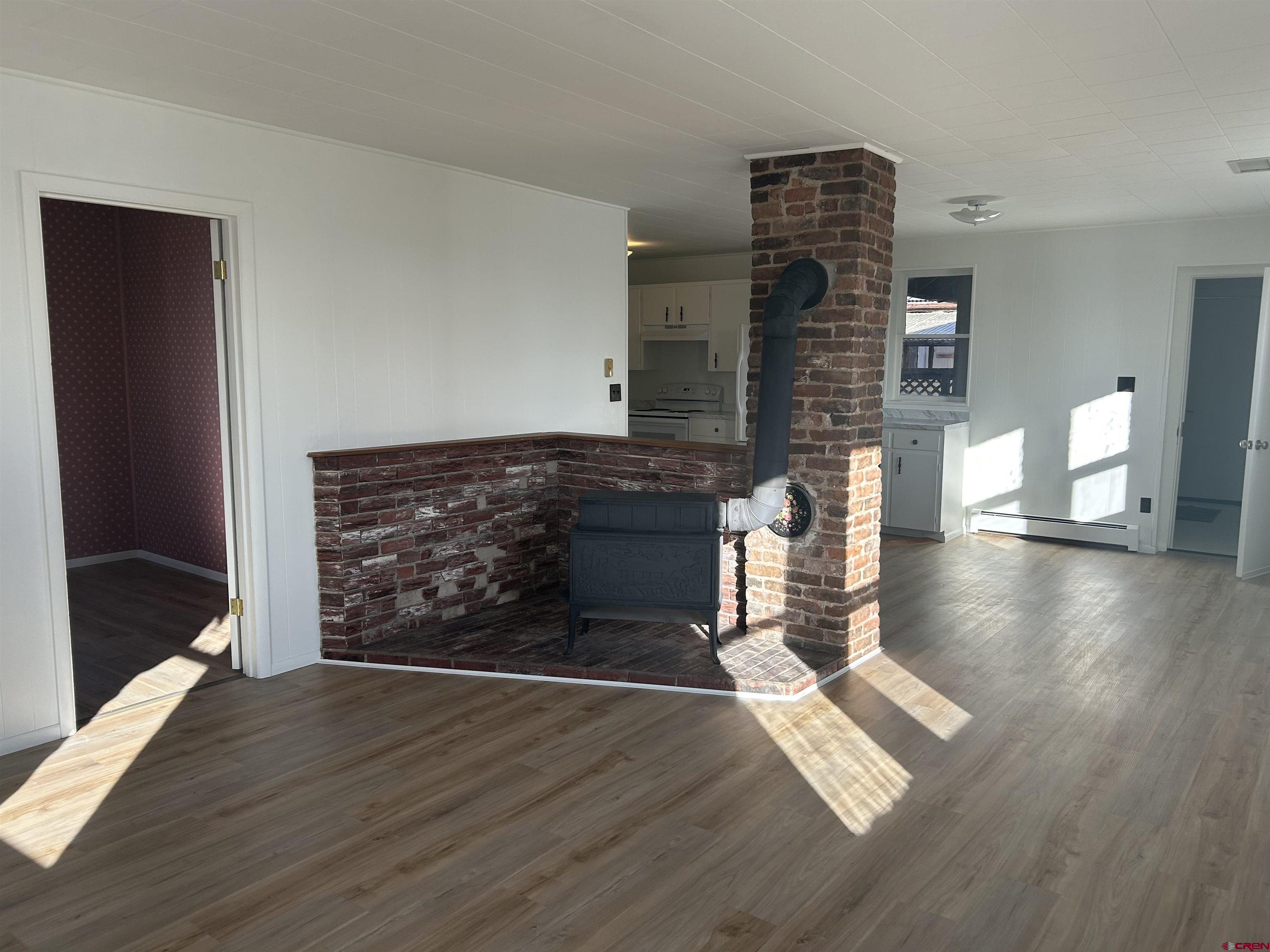 281 Fox Street Nucla, CO 81424 - Photo 8 of 21 a view of an empty room and wooden floor