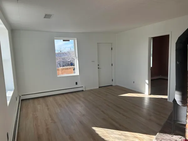 a view of an empty room with a window