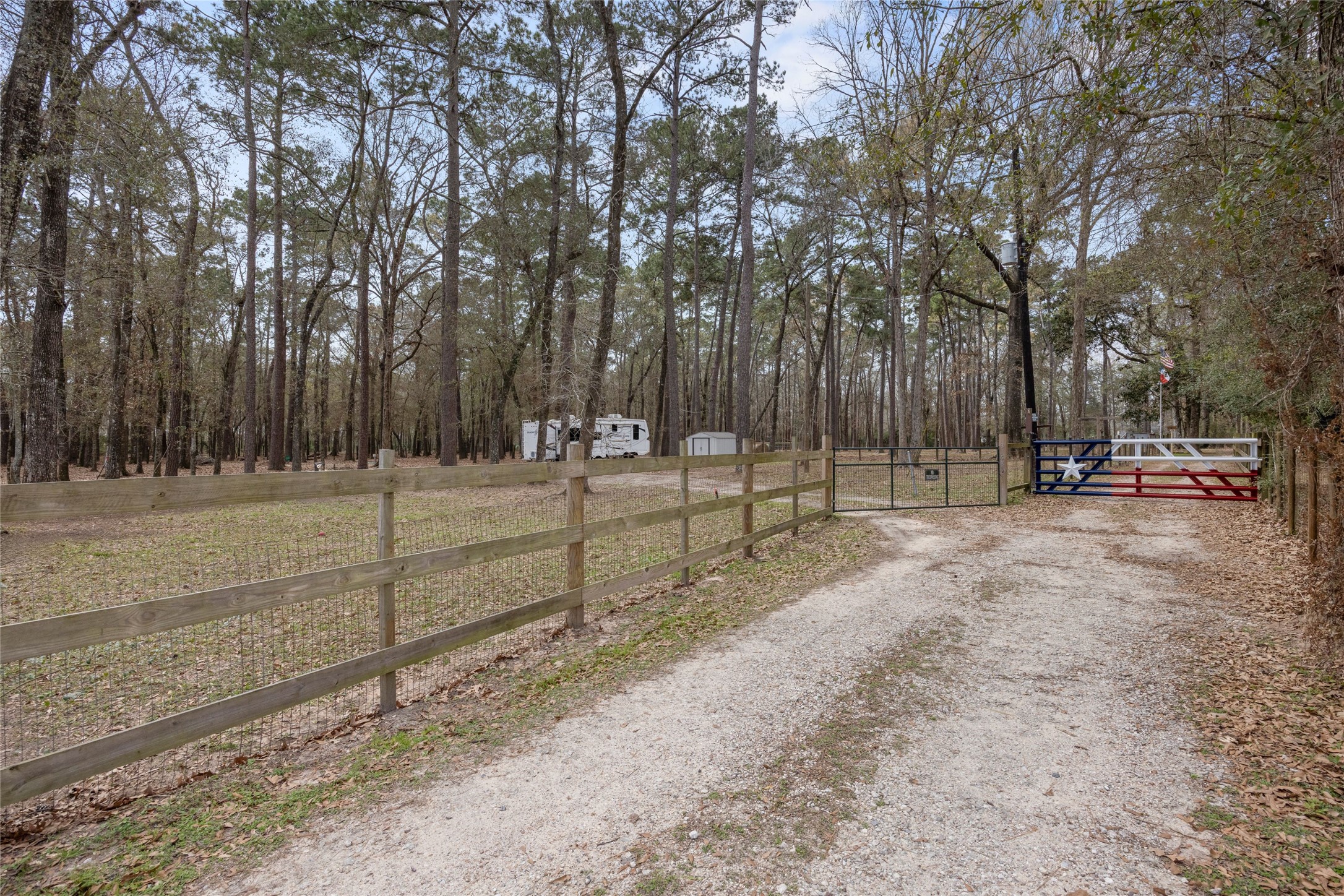 Welcome Home! The main home is through the red, white, blue gate. The other gate leads to the RV (tenant occupied) area.