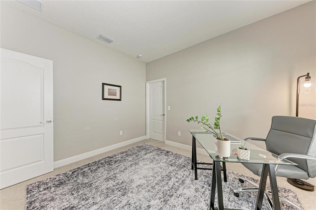 4211 Rustling Pines Terrace Parrish, FL 34219 - Photo 34 of 87 a workspace room with furniture and wooden floor