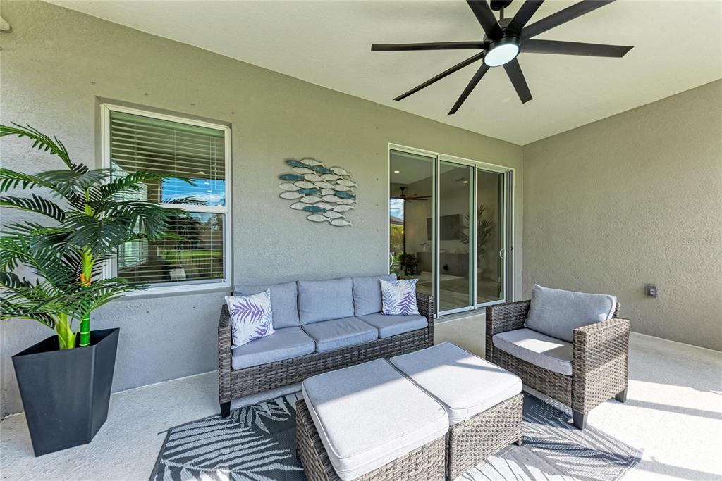 4211 Rustling Pines Terrace Parrish, FL 34219 - Photo 43 of 87 a living room with furniture and a potted plant