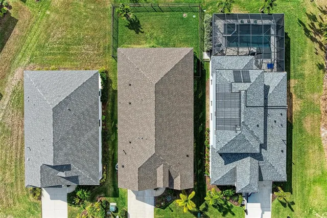 a swimming pool with outdoor seating and yard