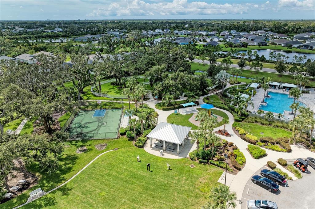 4211 Rustling Pines Terrace Parrish, FL 34219 - Photo 73 of 87 an aerial view of a house with a yard