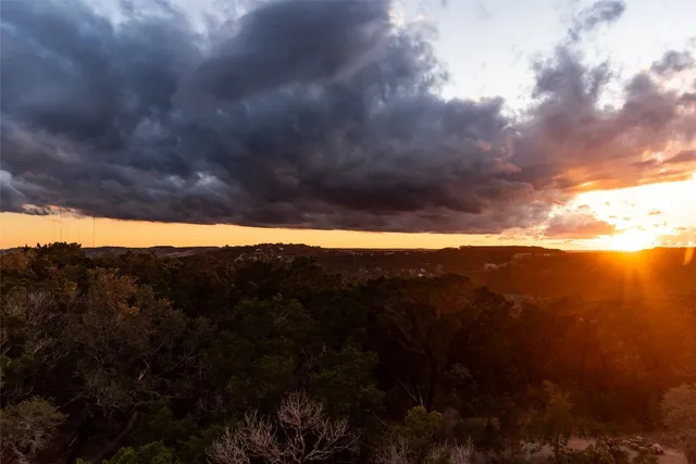 a view of a lush green space with sea
