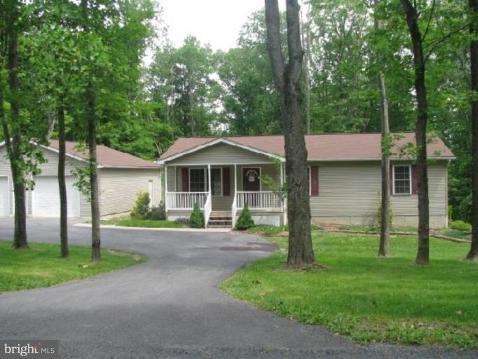 21 Drummer Hill Road Front Royal, VA 22630 - Photo 1 of 11 a front view of a house with garden