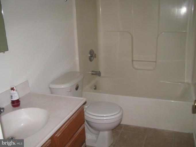 21 Drummer Hill Road Front Royal, VA 22630 - Photo 6 of 11 a bathroom with a sink a toilet and shower