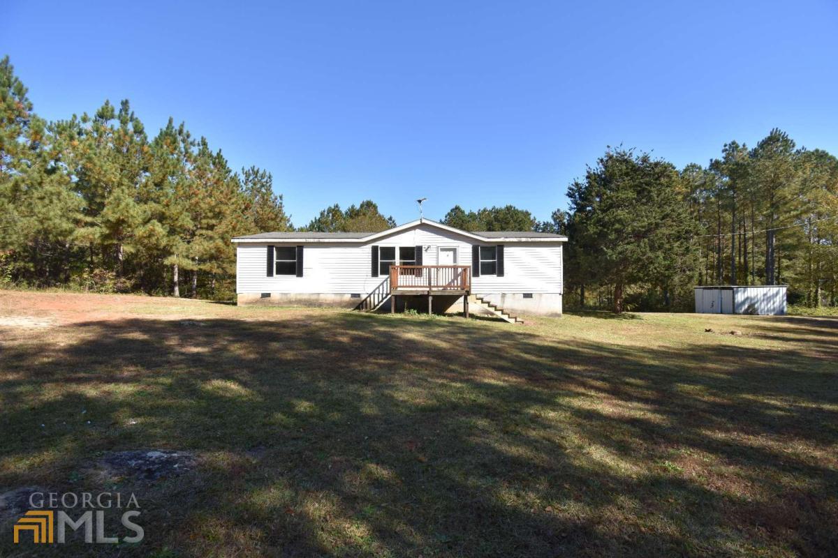 3320 Centerville Road Lexington, GA 30648 - Photo 1 of 1 a front view of a house with a yard and garage